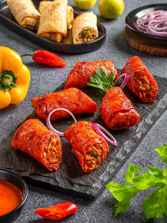 Tandoori Loaded Fried Spring Rolls with onion and lemon
